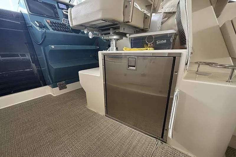 Slide: The Image of Interior of 2014 Pursuit SC 365i Sport Coupe with seating and storage. - 18