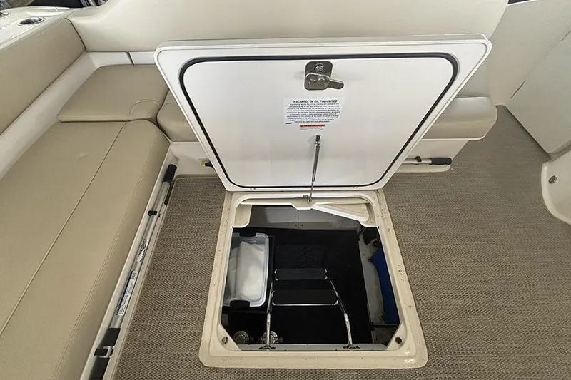 Slide: The Image of Open hatch on 2014 Pursuit SC 365i Sport Coupe, revealing storage compartment. - 20