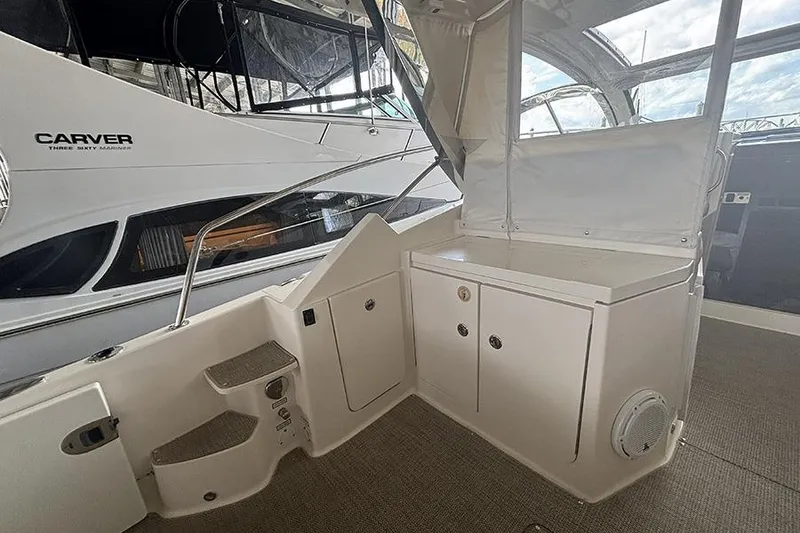 Slide: The Image of 2014 Pursuit SC 365i Sport Coupe interior with storage cabinets and steps. - 31