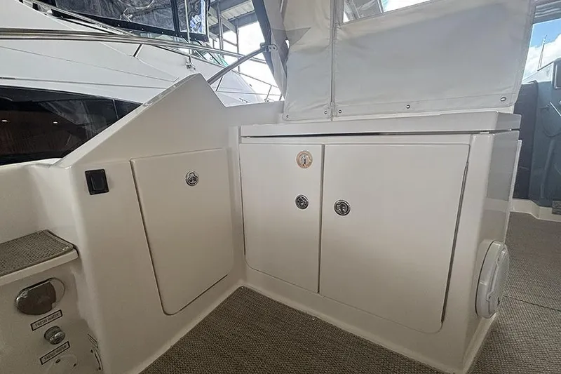 Slide: The Image of 2014 Pursuit SC 365i Sport Coupe interior storage compartments on a luxury yacht. - 33