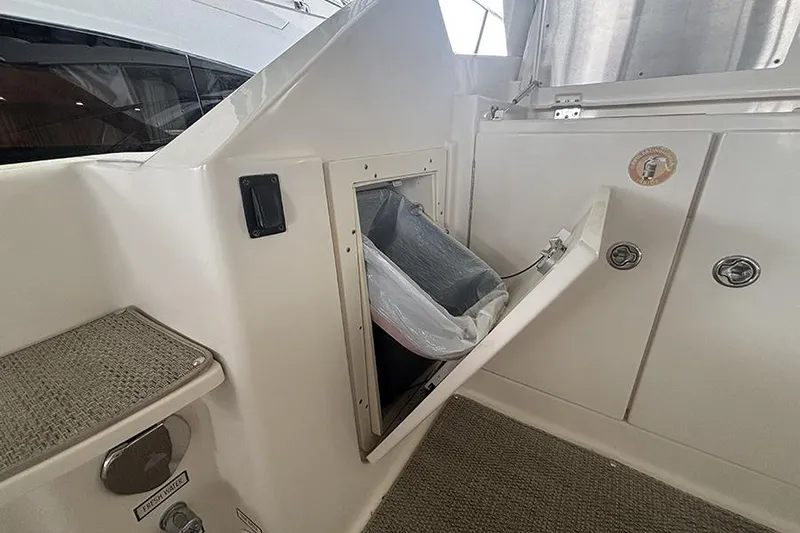 Slide: The Image of 2014 Pursuit SC 365i Sport Coupe interior with built-in trash compartment. - 36