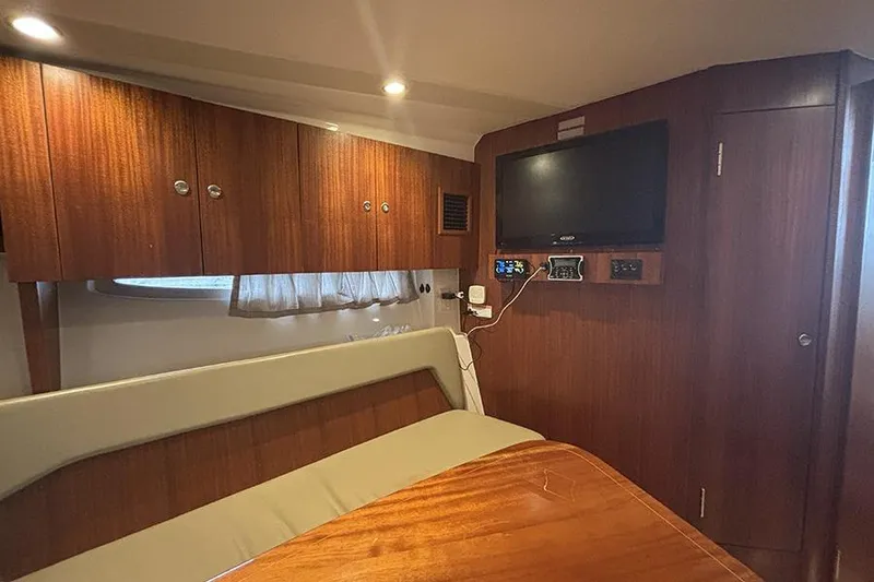 Slide: The Image of Interior of 2014 Pursuit SC 365i Sport Coupe with wood paneling and modern amenities. - 39