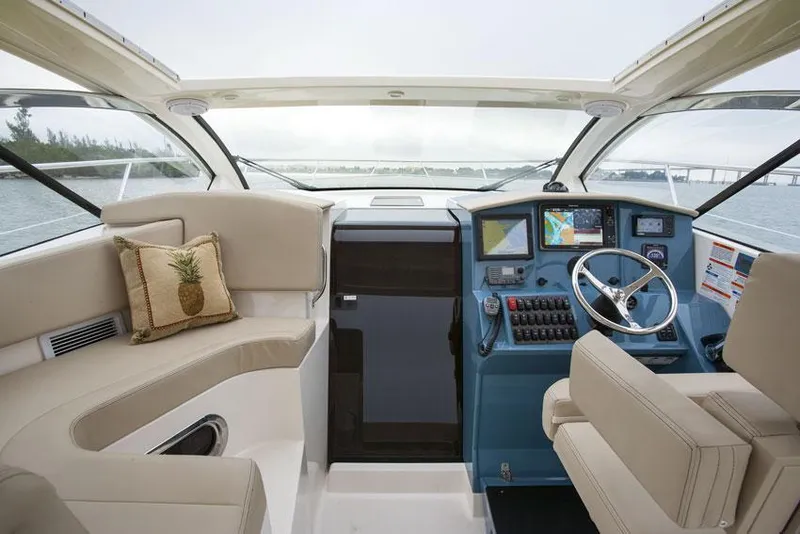Slide: The Image of Manufacturer Provided Image: 2014 Pursuit SC 365i Sport Coupe helm with modern navigation system and comfortable seating. - 5