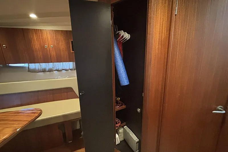 Slide: The Image of Interior of 2014 Pursuit SC 365i Sport Coupe with open wooden closet and seating area. - 53