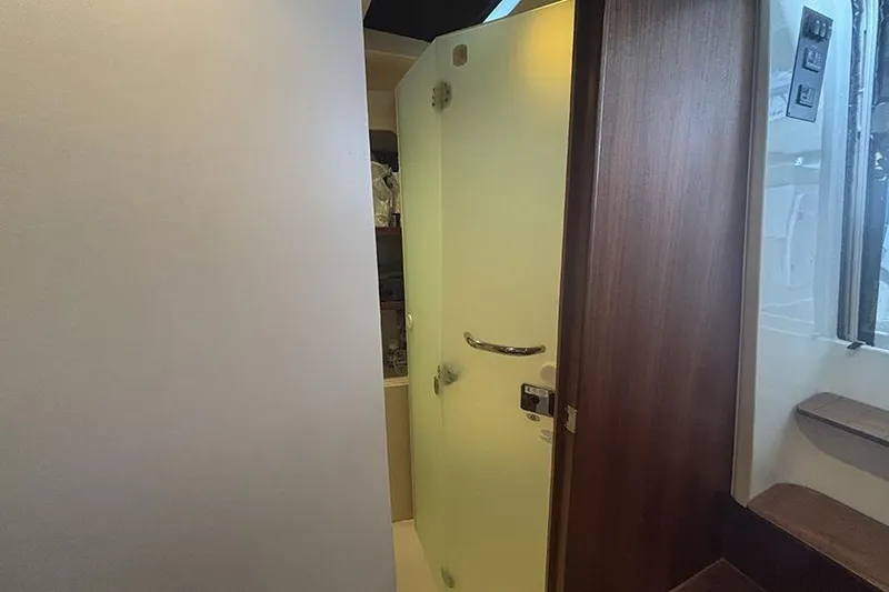 Slide: The Image of Interior of 2014 Pursuit SC 365i Sport Coupe, featuring a modern bathroom door. - 55