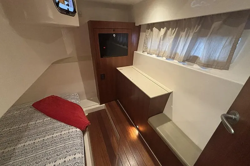 Slide: The Image of Interior cabin of 2014 Pursuit SC 365i Sport Coupe with wood flooring and cozy seating. - 58