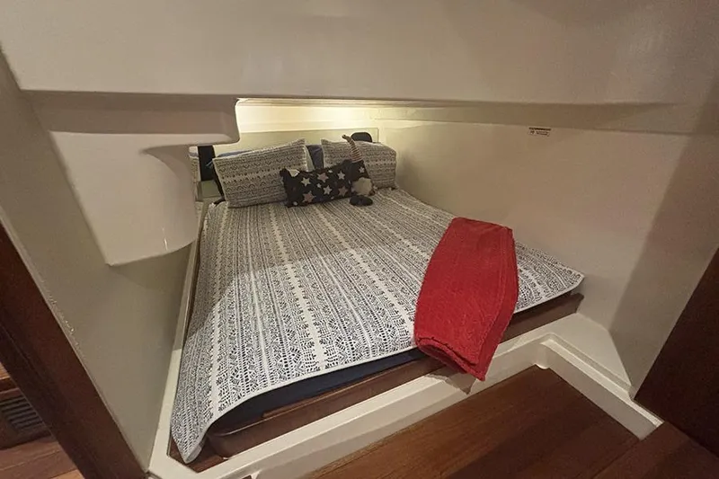 Slide: The Image of 2014 Pursuit SC 365i Sport Coupe cabin with cozy bed and decorative pillows. - 59