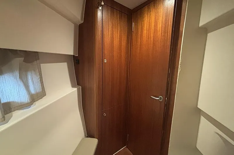 Slide: The Image of Interior of 2014 Pursuit SC 365i Sport Coupe with wooden door and seating area. - 61