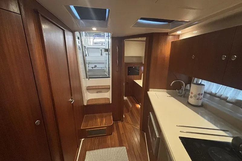 Slide: The Image of Interior of 2014 Pursuit SC 365i Sport Coupe with wood finishes and modern amenities. - 66