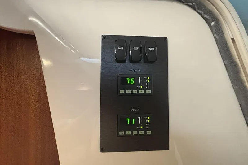 Slide: The Image of Control panel in 2014 Pursuit SC 365i Sport Coupe displaying cockpit and cabin air temperatures. - 67