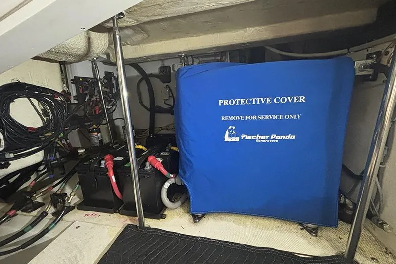 Slide: The Image of Engine room of 2014 Pursuit SC 365i Sport Coupe with protective cover and batteries. - 71