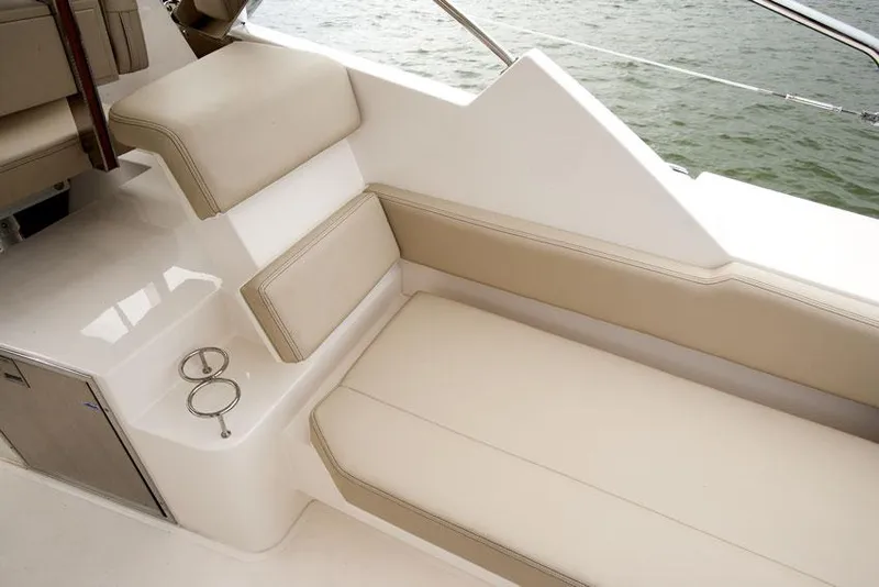 Slide: The Image of Manufacturer Provided Image: 2014 Pursuit SC 365i Sport Coupe interior seating area with beige cushions. - 9