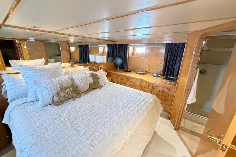 Slide: The Image of Luxurious bedroom interior of 2001 Tarrab Motor Yacht with elegant bedding and wood accents. - 14