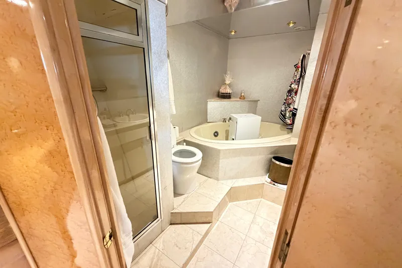 Slide: The Image of Luxurious bathroom on 2001 Tarrab Motor Yacht with jacuzzi and modern fixtures. - 16