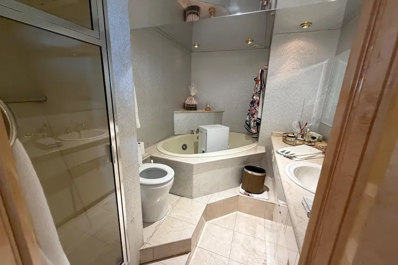 Slide: The Image of Luxurious bathroom on 2001 Tarrab Motor Yacht with jacuzzi, toilet, and elegant fixtures. - 18