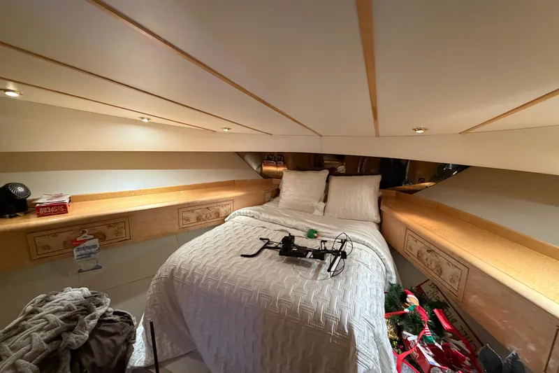 Slide: The Image of Cozy bedroom interior of 2001 Tarrab Motor Yacht with elegant wood accents and soft lighting. - 25
