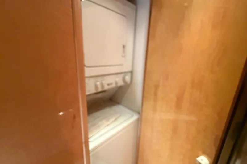 Slide: The Image of Stacked washer and dryer in 2001 Tarrab Motor Yacht laundry area. - 28