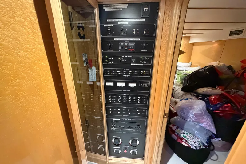 Slide: The Image of Control panel inside 2001 Tarrab Motor Yacht, featuring various switches and dials. - 3