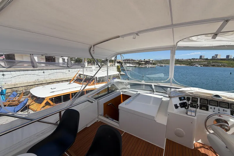 Slide: The Image of Cockpit view of 2001 Tarrab Motor Yacht with waterfront scenery. - 32