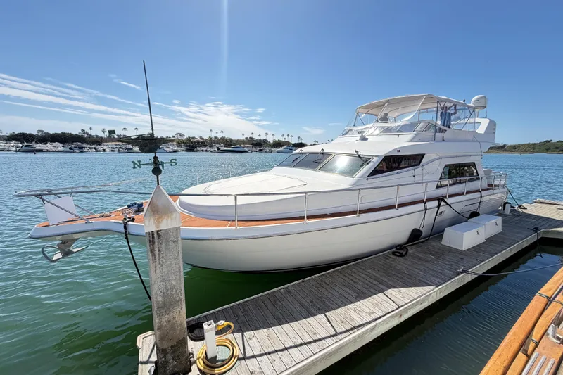 Slide: The Image of 2001 Tarrab Motor Yacht docked in a sunny marina, showcasing sleek design and luxury features. - 36
