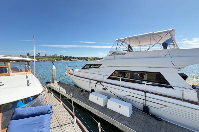 Slide: The Image of Tarrab 2001 motor yacht docked at marina under clear blue sky. - 37