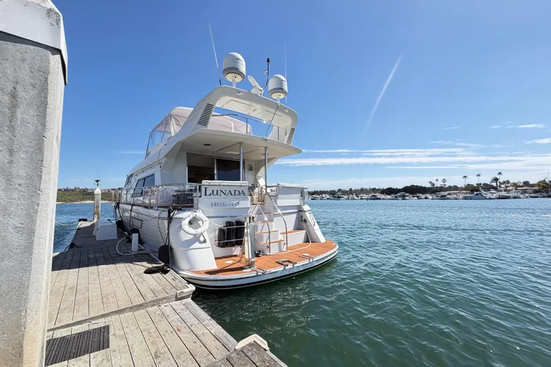 Slide: The Image of Tarrab 2001 motor yacht docked at marina under clear blue sky. - 39
