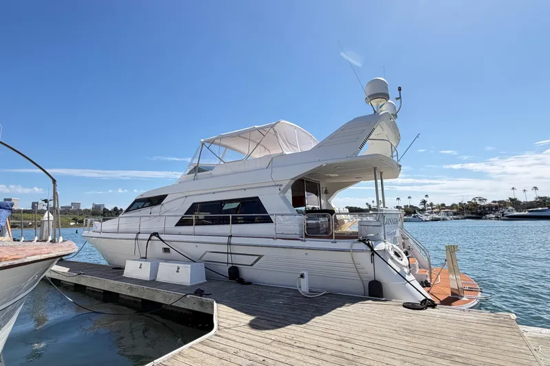 Slide: The Image of 2001 Tarrab Motor Yacht docked at marina under clear blue sky. - 41