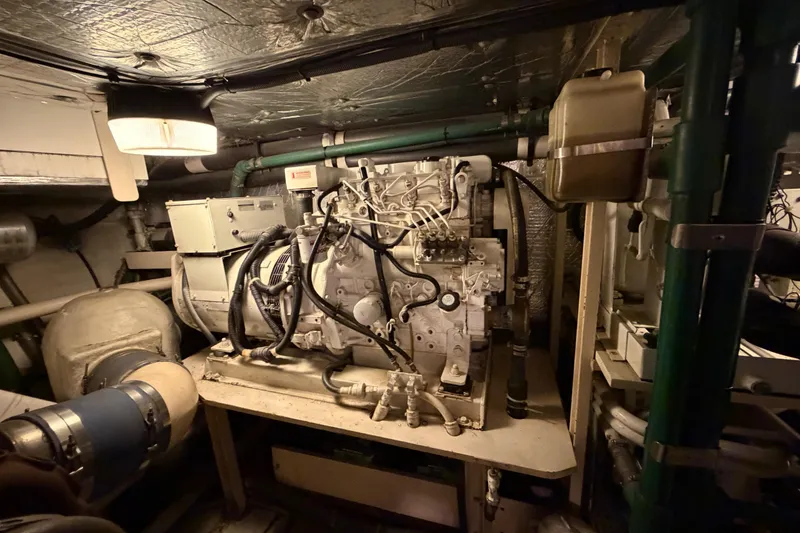 Slide: The Image of Engine room of 2001 Tarrab Motor Yacht with visible machinery and piping. - 46