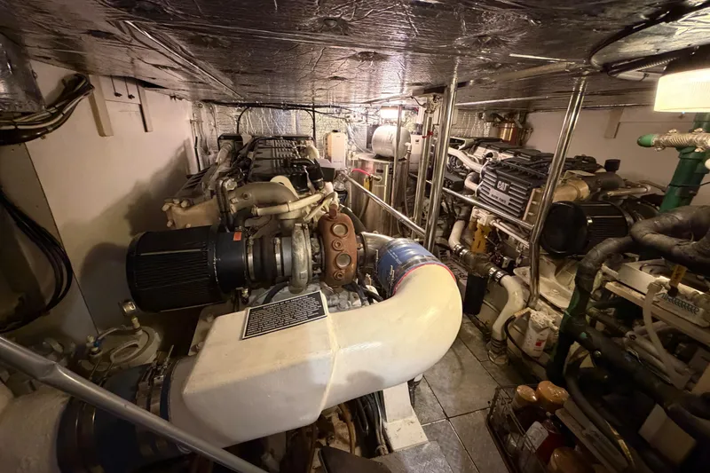 Slide: The Image of Engine room of a 2001 Tarrab Motor Yacht, showcasing machinery and equipment. - 48