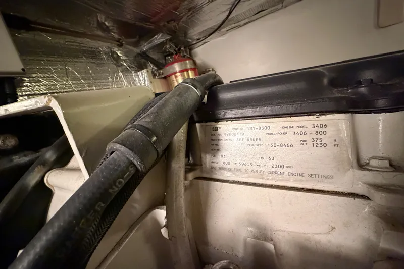 Slide: The Image of Engine room of a 2001 Tarrab Motor Yacht, featuring detailed engine specifications. - 50