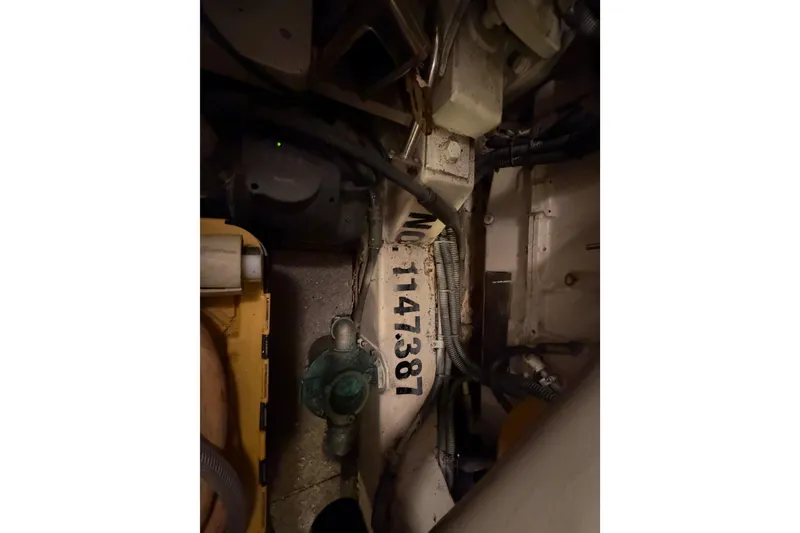 Slide: The Image of Engine room of 2001 Tarrab Motor Yacht, showing serial number and mechanical components. - 51