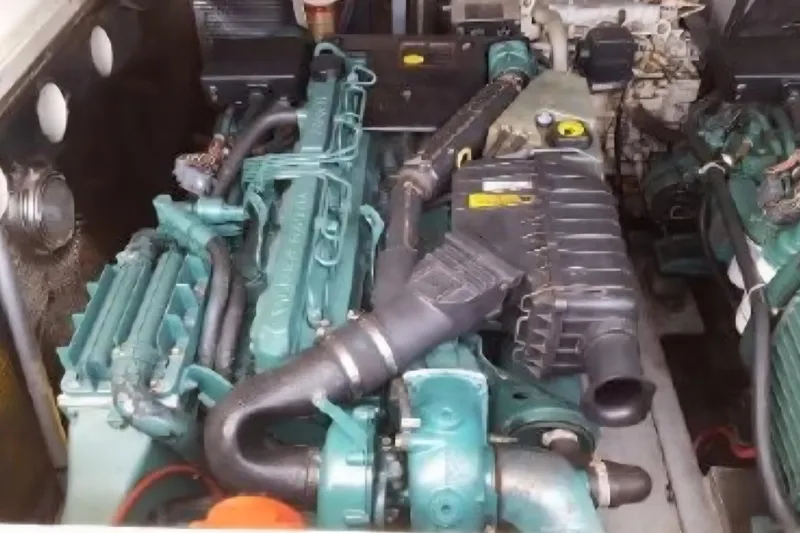 Slide: The Image of Engine compartment of a 2004 Carolina Classic 28 boat, showcasing detailed machinery. - 8