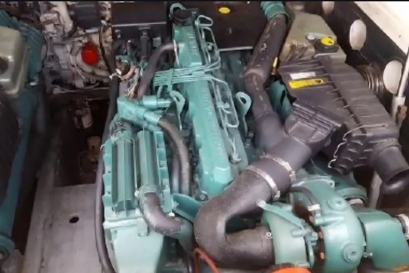 Slide: The Image of Engine compartment of a 2004 Carolina Classic 28 boat, showcasing detailed components. - 9