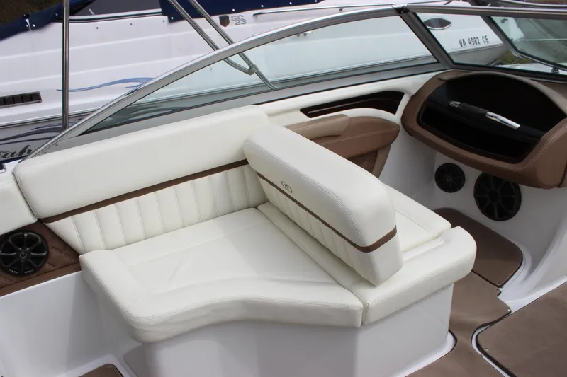 Slide: The Image of Interior of 2012 Cobalt A25 boat with white leather seating and modern dashboard. - 10