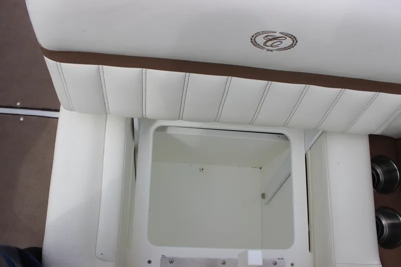 Slide: The Image of White leather seat with storage compartment in 2012 Cobalt A25 boat. - 14