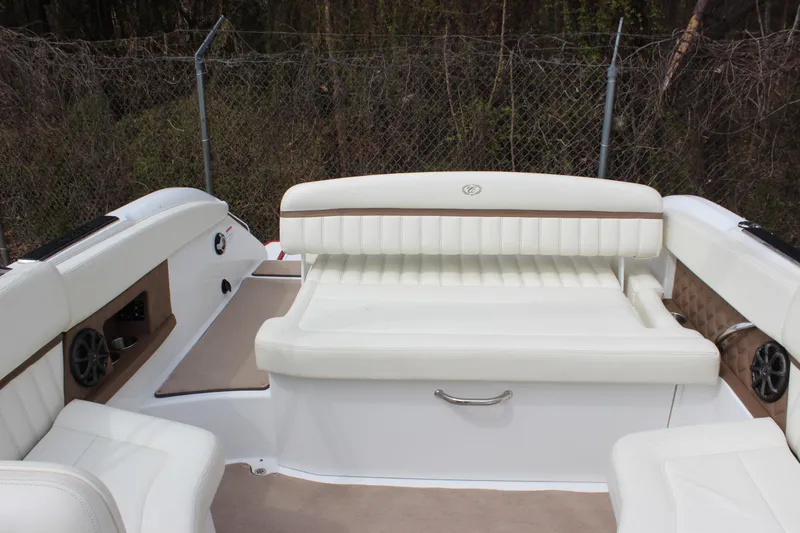 Slide: The Image of 2012 Cobalt A25 boat interior with white seating and beige accents. - 29