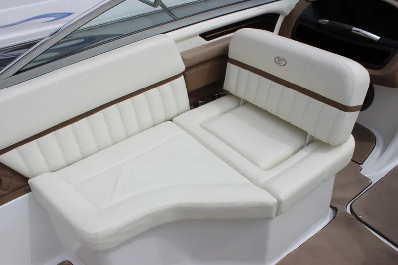Slide: The Image of Luxurious white seating in a 2012 Cobalt A25 boat interior. - 30