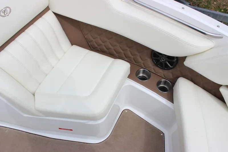 Slide: The Image of Luxurious interior seating of 2012 Cobalt A25 boat with white upholstery and cup holders. - 4
