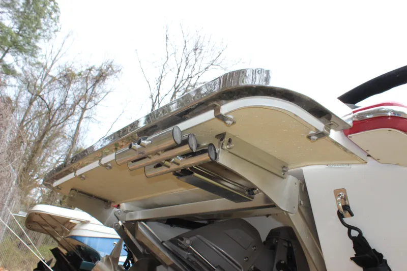 Slide: The Image of Rear view of a 2012 Cobalt A25 boat with a stainless steel swim platform. - 44