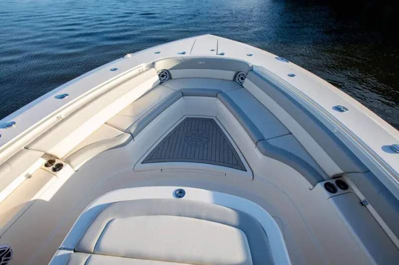 Slide: The Image of Manufacturer Provided Image: Luxurious 2025 Scout 425 LXF boat interior with cushioned seating and sleek design. - 4