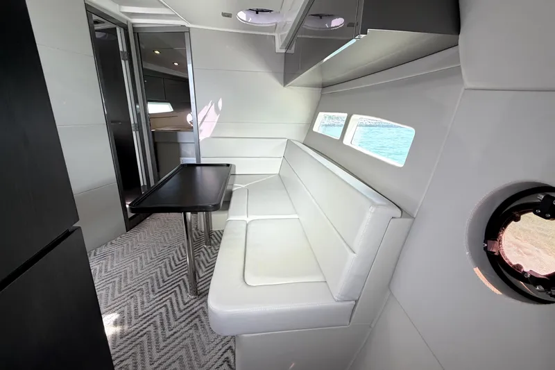 Slide: The Image of Modern interior of 2024 Schaefer 400 yacht with sleek seating and table. - 11