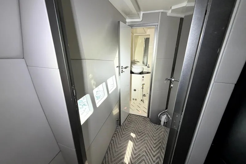 Slide: The Image of Interior view of 2024 Schaefer 400 yacht, featuring a modern bathroom and sleek design. - 13