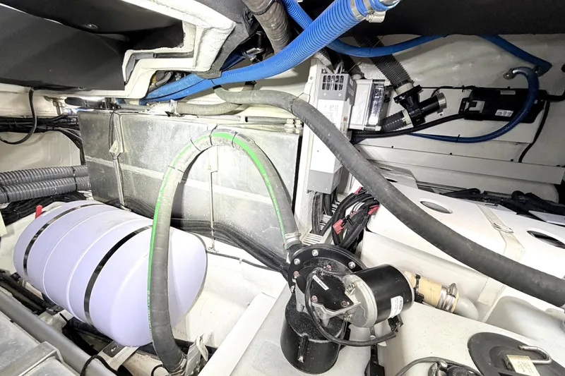 Slide: The Image of Engine room of a 2024 Schaefer 400 yacht, showcasing mechanical components and wiring. - 23
