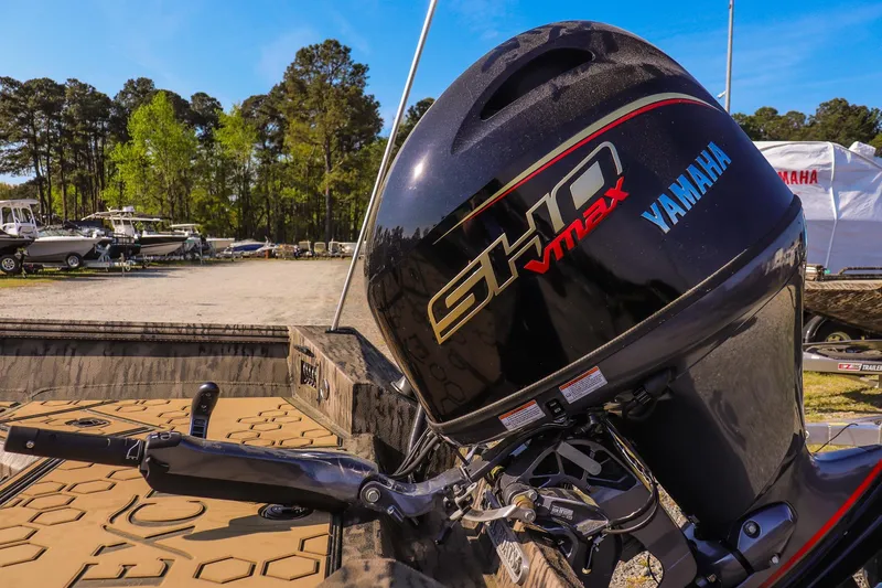 Slide: The Image of 2026 Excel 183 Tomahawk boat with Yamaha SHO VMAX outboard motor in a marina setting. - 15