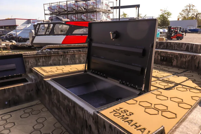 Slide: The Image of Open storage compartment on 2026 Excel 183 Tomahawk boat, showcasing interior design. - 19