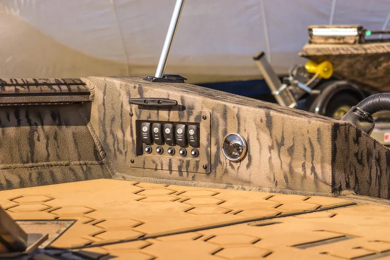 Slide: The Image of Control panel of 2026 Excel 183 Tomahawk boat with switches and fuel gauge. - 20