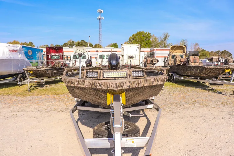 Slide: The Image of 2026 Excel 183 Tomahawk boat on trailer in outdoor lot. - 8
