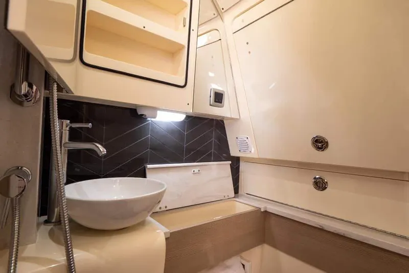 Slide: The Image of Manufacturer Provided Image: Luxurious bathroom interior of 2025 Scout 400 LXF Li-Ion boat. - 13