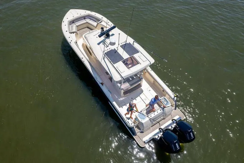 Slide: The Image of Manufacturer Provided Image: Aerial view of 2025 Scout 400 LXF Li-Ion boat on water. - 2