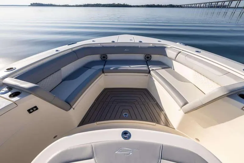 Slide: The Image of Manufacturer Provided Image: 2025 Scout 400 LXF Li-Ion boat interior with luxurious seating on calm water. - 4